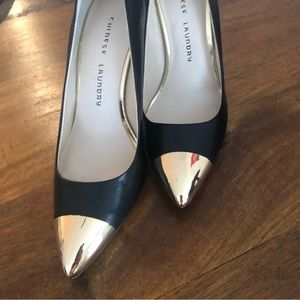 NWOT Black pump with gold toe. Size 7.5 GORGEOUS